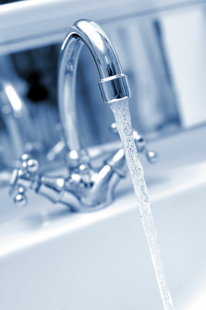 drinking water from the tap.